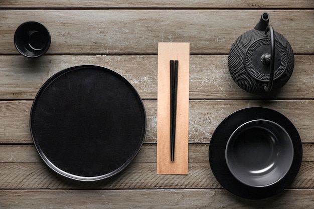 Top view of plate with teapot and chopsticks