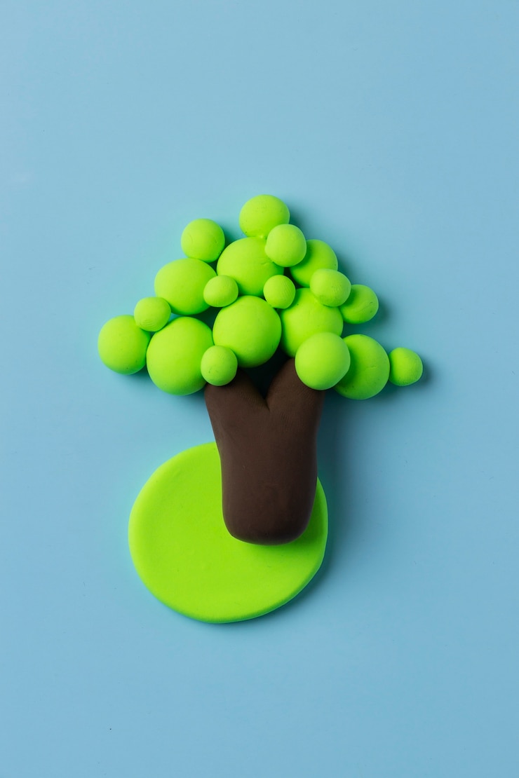 Free Photo top view play dough tree with blue background