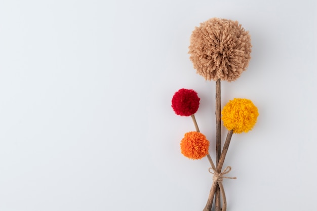 Top view pom poms with copy space background