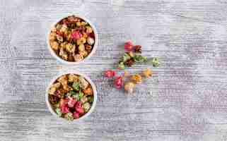 Free photo top view of popcorn in bowls on white wooden  horizontal