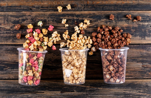 Top view of popcorn on dark wooden  horizontal