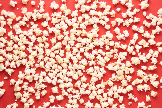 Top view popcorn on red background