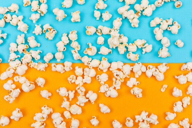 Top view of popcorn texture on blue and yellow  horizontal