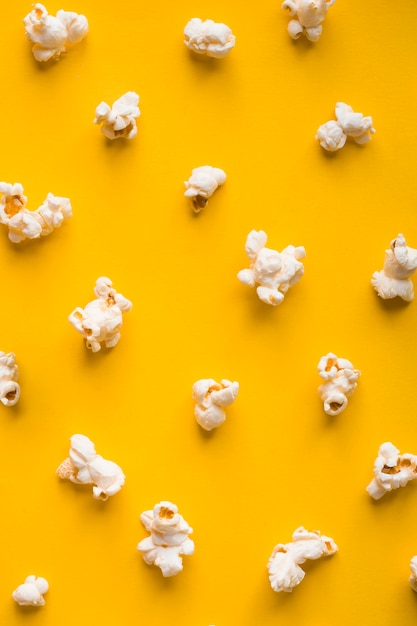 Top view popcorn on yellow background