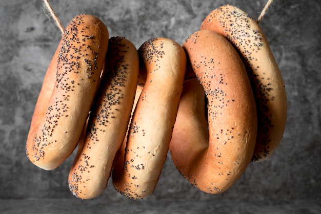 Top view poppy seed bagels on string