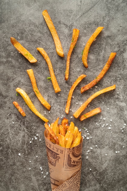 Free photo top view potato fries arrangement