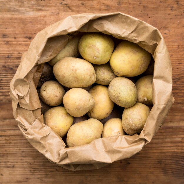 Top view potatoes in paper bag