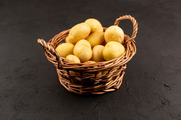 top view potatoes whole inside basket on the dark background