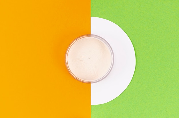 Top view powder on colorful background