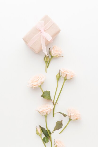 Top view of present with roses and ribbon