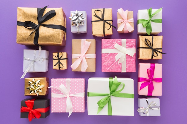 Top view of presents with multicolored ribbon and wrapping