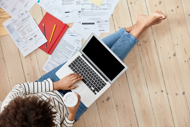 Top view of professional young businesswoman working at home