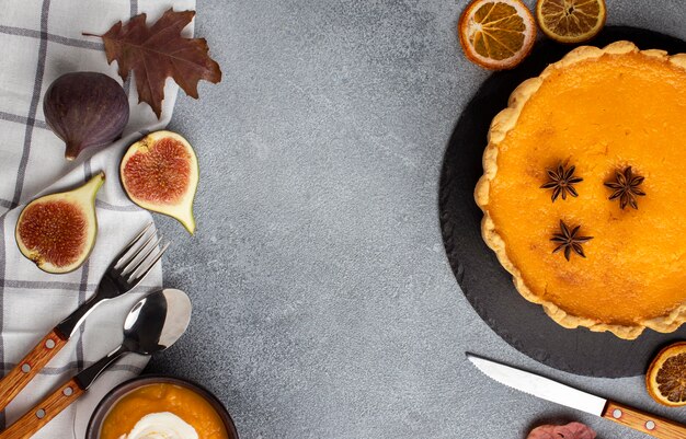 Top view pumpkin pie and cutlery