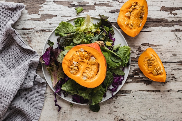 Top view pumpkin and salad