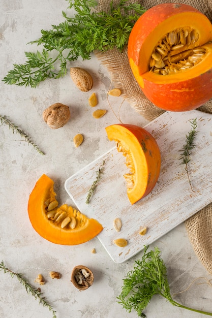 Top view pumpkin slice on wooden board