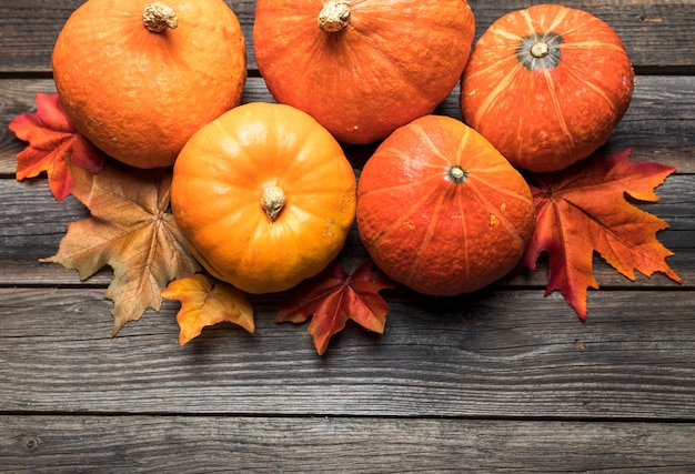 Top view pumpkins arrangement on wooden table