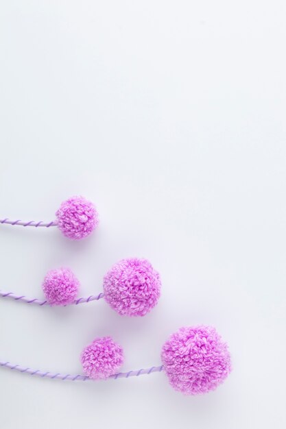 Top view purple pom poms arrangement