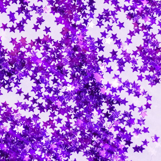 Top view purple sequins pile