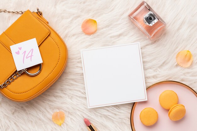 Top view of purse with rose petals and perfume from valentine's day