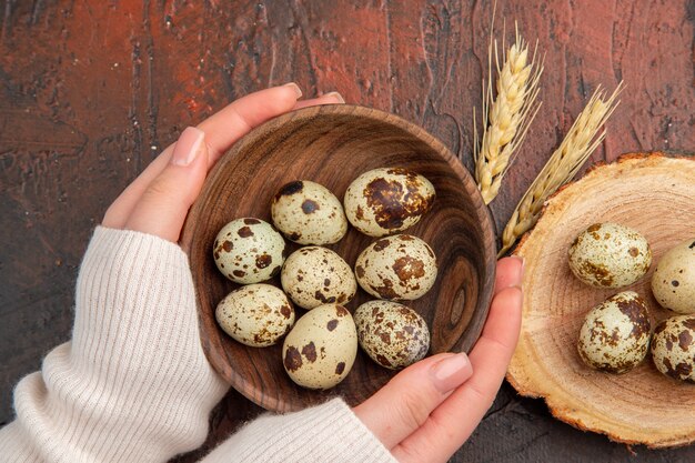 Top view quail eggs inside plate on the dark table photo color bird food chicken healthy life female