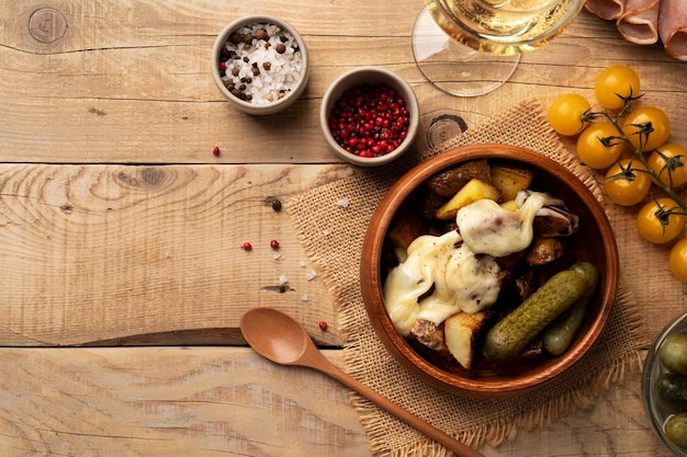 Top view of raclette dish with ingredients and delicious food