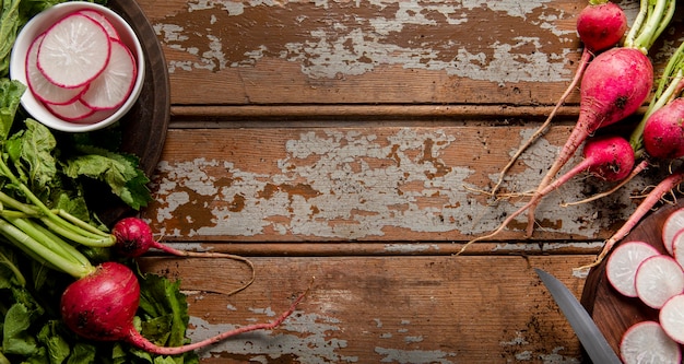 Top view of radishes on wooden surface