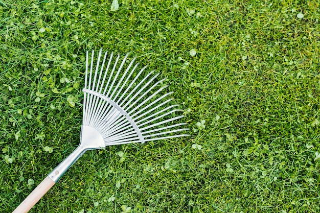 Free photo top view rake on the grass