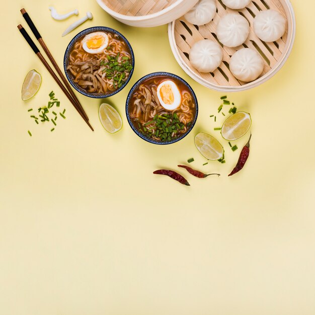 Top view of ramen bowls and dim sum