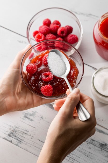 Top view of raspberries in glass bowls