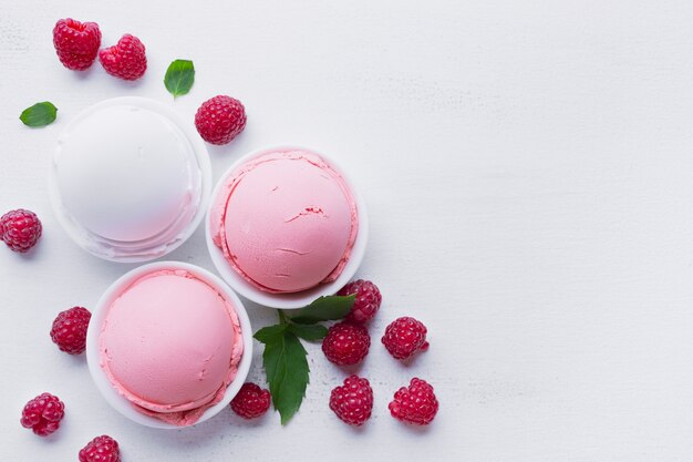 Top view of raspberries and vanilla ice cream