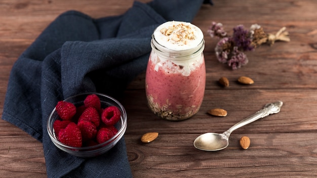 Top view raspberry smoothie on wooden table