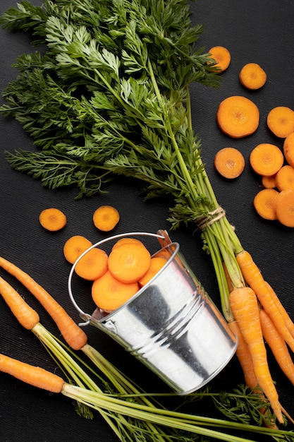 Top view raw carrots arrangement