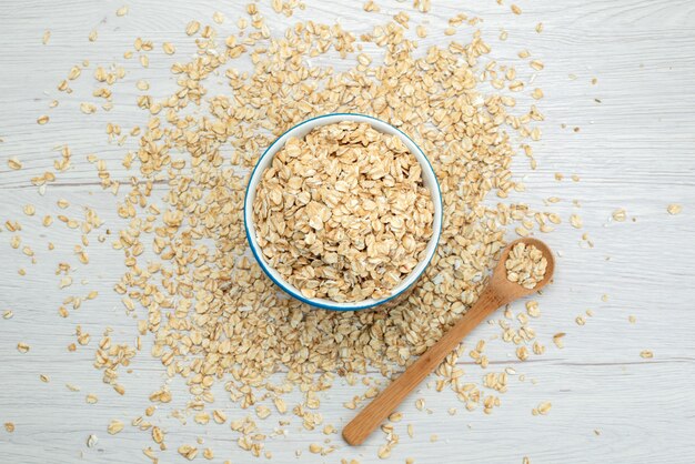 Top view raw cereals on white, raw breakfast food meal