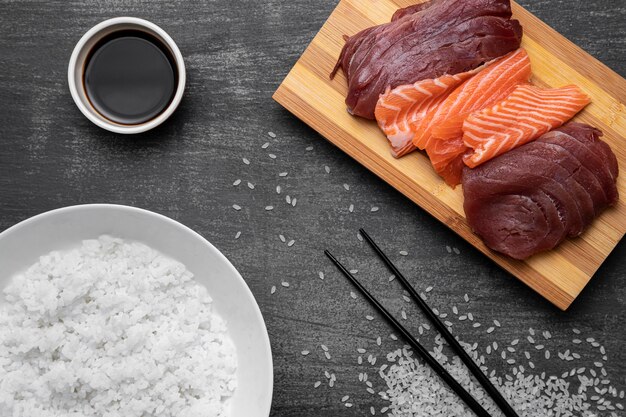 Top view raw fish and rice arrangement