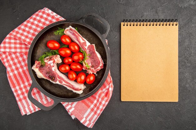 Top view raw meat slices with red tomatoes inside pan on gray background meat chicken raw cow pepper color animal