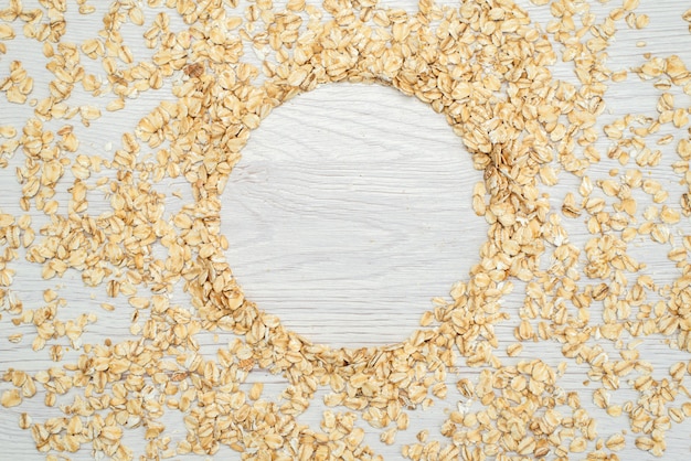 Top view raw oatmeals on white, cereal cornflakes breakfast