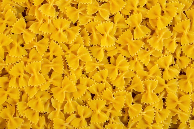 Top view of raw pasta farfalle seamless pattern