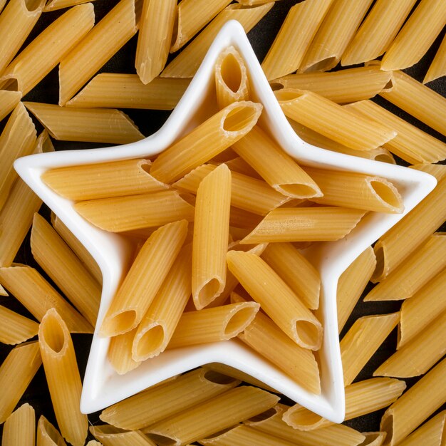 Top view of raw pasta in a star-shaped rosette