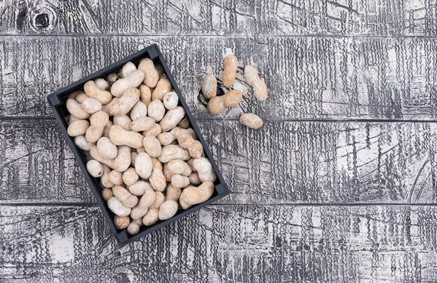 Top view raw peanuts on wooden  horizontal