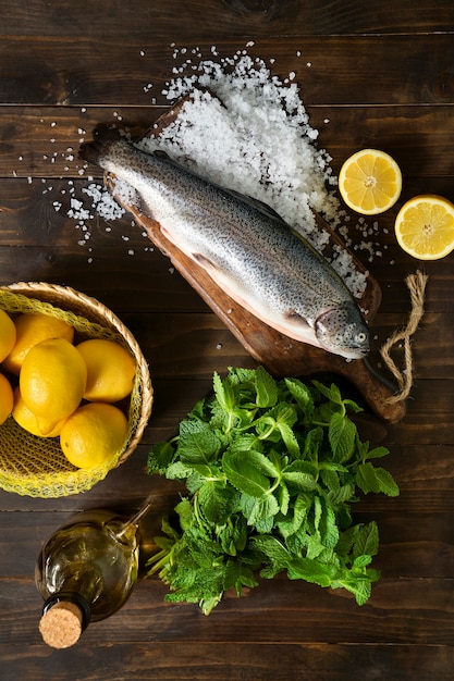 Free photo top view raw trout still life