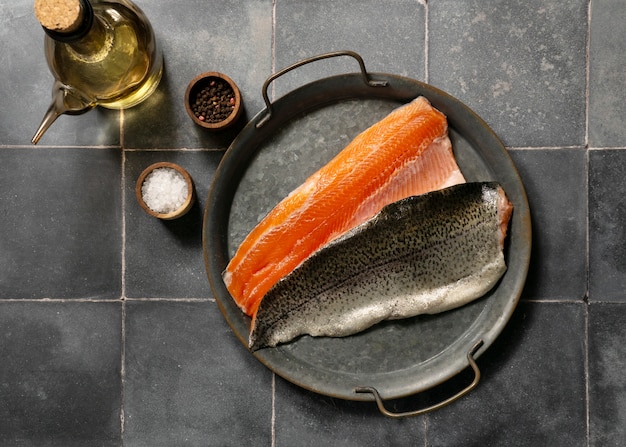 Free photo top view raw trout still life