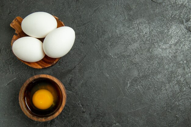 Top view raw whole eggs on grey background egg breakfast meal food raw