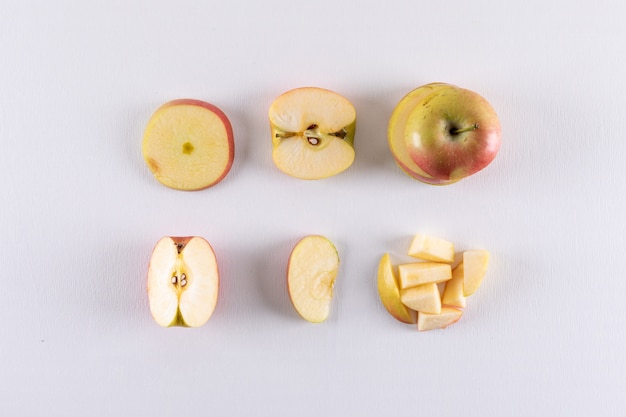 Top view red apples sliced on white  horizontal