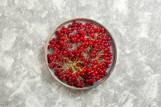 Top view red berries mellow fruits on a white background