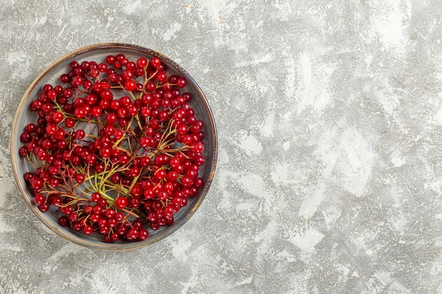 Free photo top view red berries mellow fruits on the white background