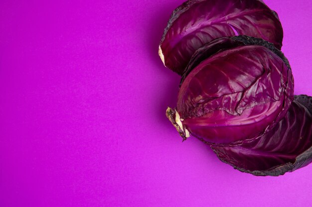 Top view of red cabbage with copy space on purple