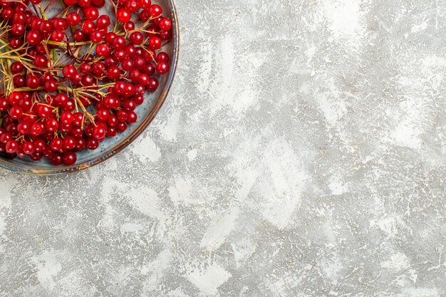 Top view red cranberries mellow fruits on white background