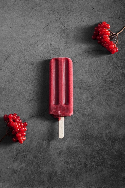 Top view red flavored ice cream on stick