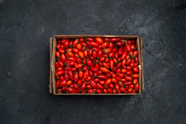 Top view red fruits ripe and sour berries on grey surface