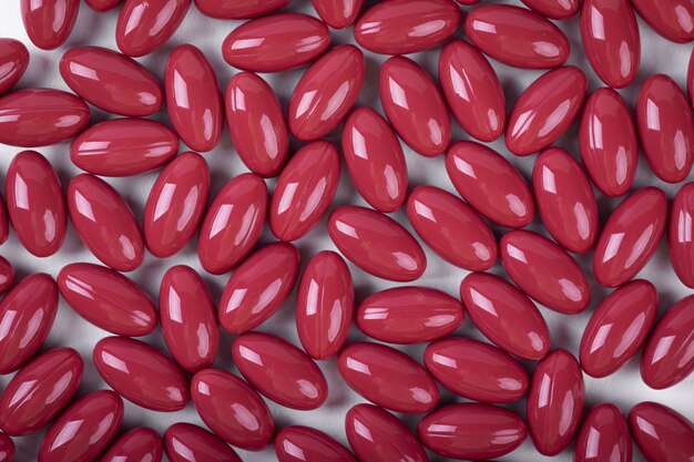 Top view of red gel capsules isolated on white surface